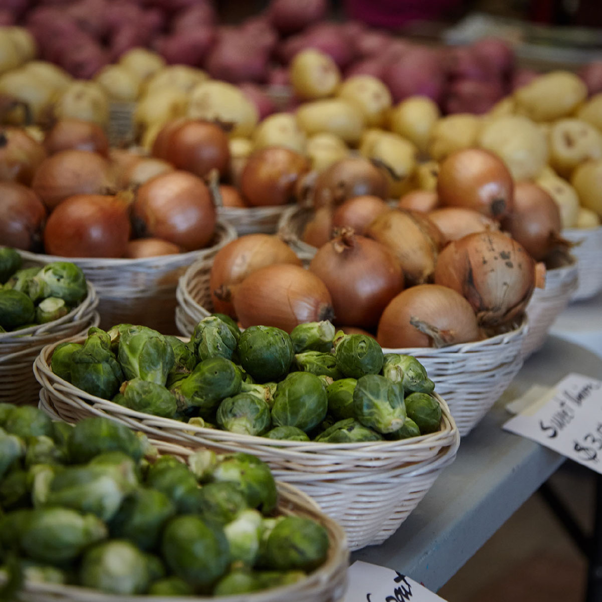 Seller's offerings of produce at farmers market at the union depot