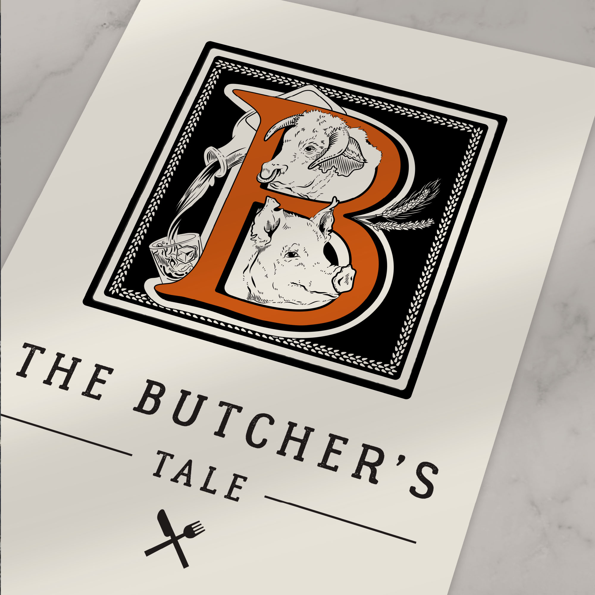 flat lay of the butcher's tale graphic design signage