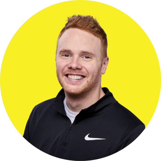 headshot of Patrick Garvey with yellow background